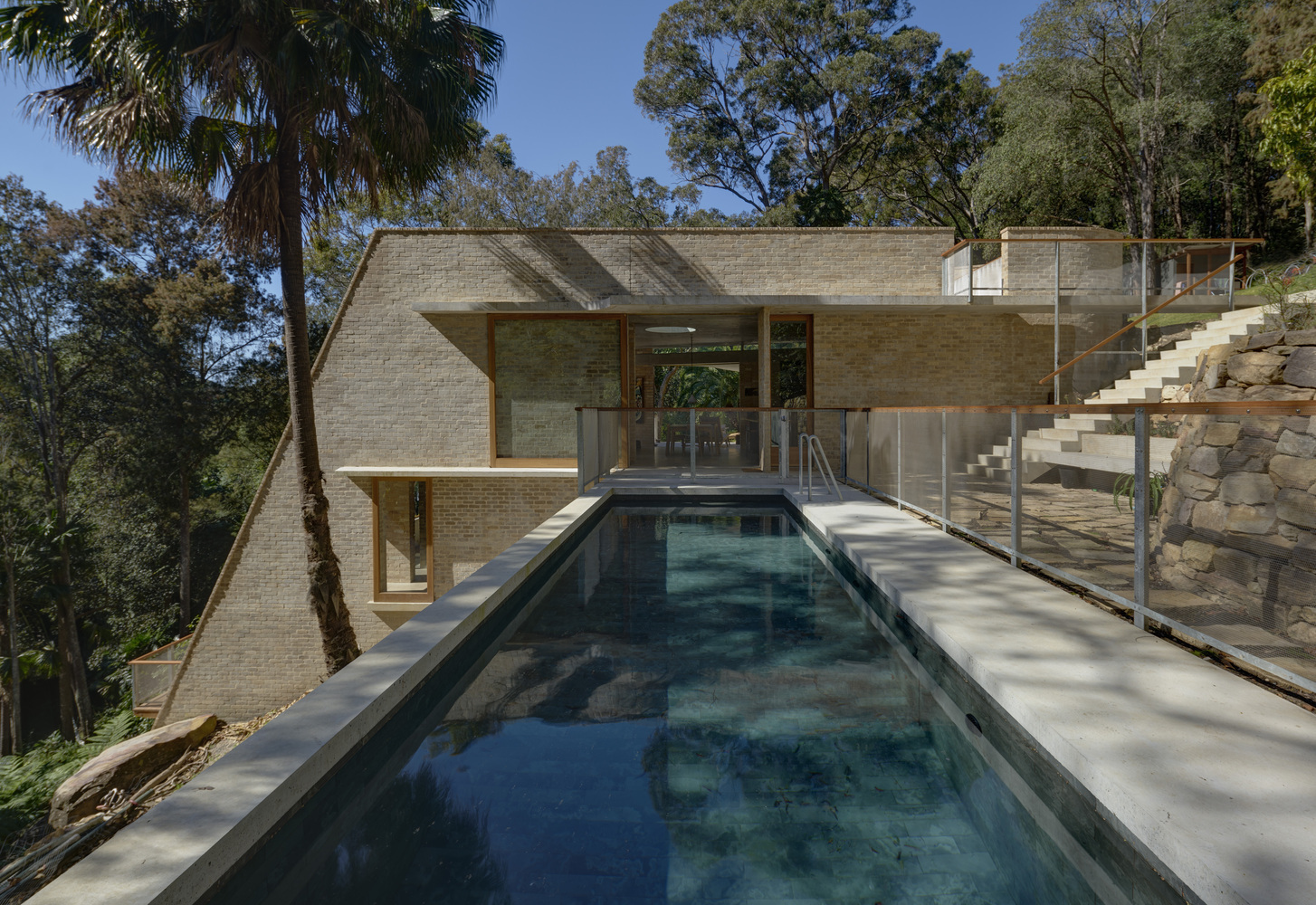 sloped to fit 14 homes that embrace the hill as a catalyst for their design - 25041